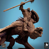 Close-up of an orc warrior holding an axe while mounted on a giant vulture.
