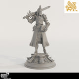 Front view of armored knight holding a large sword and book, standing on a detailed circular base.