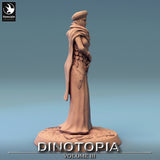 Side profile view of the resin human NPC miniature showing the draped clothing and textured base.