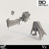 Unassembled resin miniature parts: head, torso with cannon, and legs.