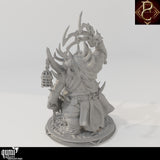Rear view of the monster miniature displaying spikes, tattered robes, and a cage hanging from its arm.