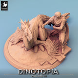 Draufsicht auf den Kundschafter, der den gefiederten Oviraptor in der 32mm Miniatur-Szene berührt.