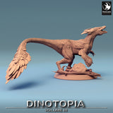 Side view of the feathered dinosaur miniature showcasing its sleek build and textured feathers.