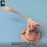 High angle shot of the Pyroraptor miniature, highlighting the feather textures and pose.