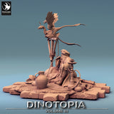 Side view of a seated miniature smoking shisha beside perched winged reptiles on a stone base.