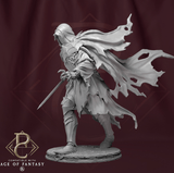 Side profile of the hooded sword fighter miniature showing cloak details