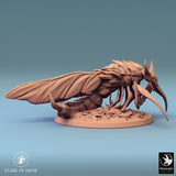 Front view of the insectoid creature on its base, showcasing its menacing mandibles.