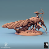 High-angle view of the insectoid monster showing the skull details on its base.