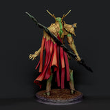 Back view of the painted Verdant Sentinel druid miniature with vibrant red cape and naturalistic root textures