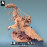 Three-quarter view of the resin dinosaur miniature showing the base with crates and supplies