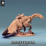 High-angle view of feathered dinosaur miniature with saddle, looking down at pots on the ground.