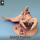 High-angle view of the Therizinosaurus miniature showing saddle, bedroll, and terrain details