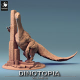 Front view of a saddled therizinosaurus leaning against a stone tower, full body shot.