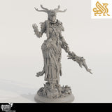 Front view of a gray resin druid miniature wearing an antler headdress and holding a staff.