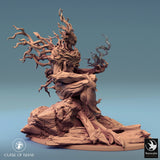 Tree monster miniature, front view, holding two wooden blade appendages.