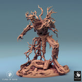 Tree monster miniature, front-right angle, dynamic claw pose on rocky base.