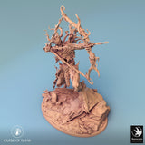 High-angle view of a fey archer miniature standing on a debris-filled base, ready for painting