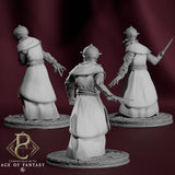 Rear view of three Chainbound Initiate miniatures showing detailed robed backs and sword equipment.