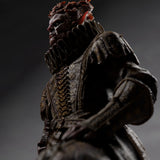 Low angle side view focusing on the textured armor and sword of the undead fighter miniature.
