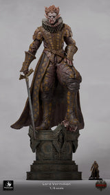 Full body shot of the 3D-printed Lord Vermillon miniature standing on a decorative base with a scale comparison figure.