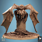 Front view of the dragon perched on a ruined stone pillar with wings spread wide.