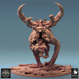 Front view of a monstrous creature with large horns and a skull-like face on a stone base.