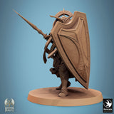 Fantasy wargaming miniature holding a shield and sword in a defensive combat stance