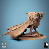 Diagonal view of the dragon miniature standing on a rubble base, focus on wing texture.