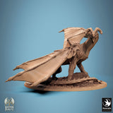 Diagonal perspective of the dragon miniature, highlighting armored saddle details.