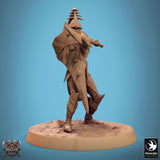 Rear angle of the Velatrix miniature showing the leg armor and the hilt of the held weapon.