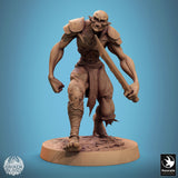 Ghoul warrior standing on a rock, raising his sword high, front view.
