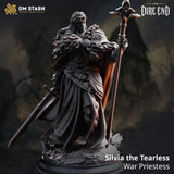 3D-printed resin miniature of Silvia the Tearless, a war priestess wearing fur-lined armor, holding a staff and sword
