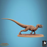Side view of a raptor miniature in a dynamic running pose.