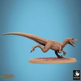 Raptor miniature with mouth open, viewed from the side.