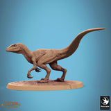 Side profile of a raptor miniature in a standing pose.