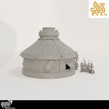 Side profile of the fantasy yurt terrain showing the door, wooden construction, and shields.